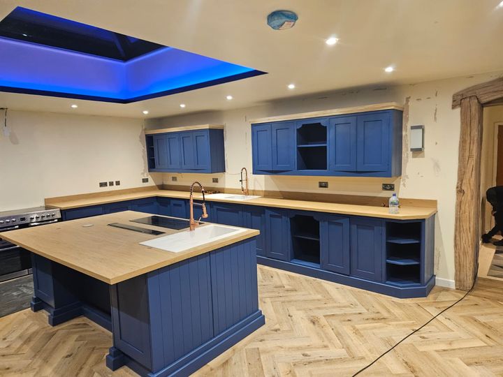 Navy shaker kitchen with island after a full respray