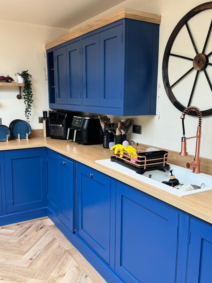 Royal blue shaker kitchen with oak worktop
