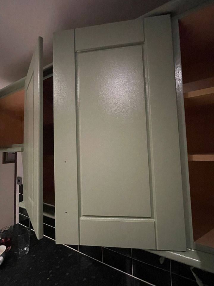 Close-up of a resprayed sage shaker door